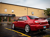 Wet Red Subaru WRX Sedan