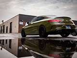 Green AMG C43 with its Reflection