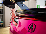 Carbon Fiber Emblem and Spoiler on Pink Acura NSX