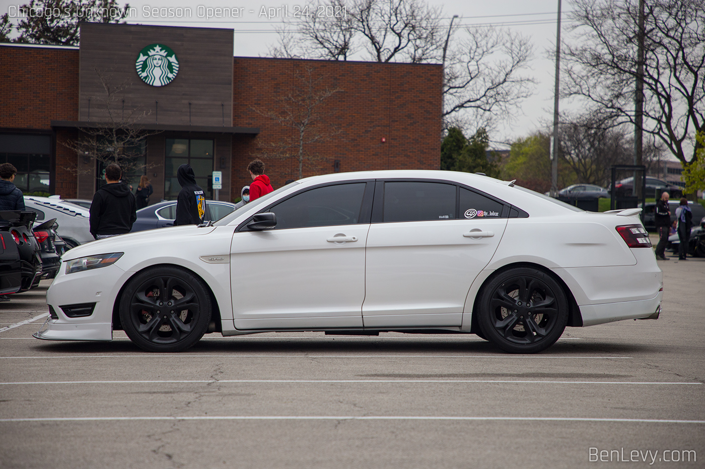 White Ford Taurus SHO with front splitter