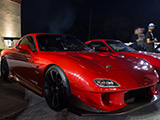 Red Mazda RX-7 with custom front bumper