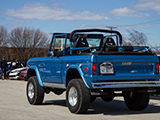 Blue Ford Bronco with top down