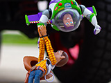 Buzz and Woody hanging off a Jeep