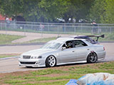 Silver Toyota Chaser on the track