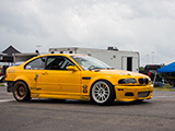 Yellow E46 M3 in the paddock of Autobahn Country Club