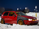 Red Volkswagen GTI with Alzor 030 Wheels and Christmas Lights