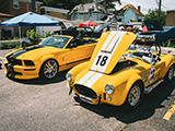 Yellow 2006 Mustang and 1965 Cobra MkII