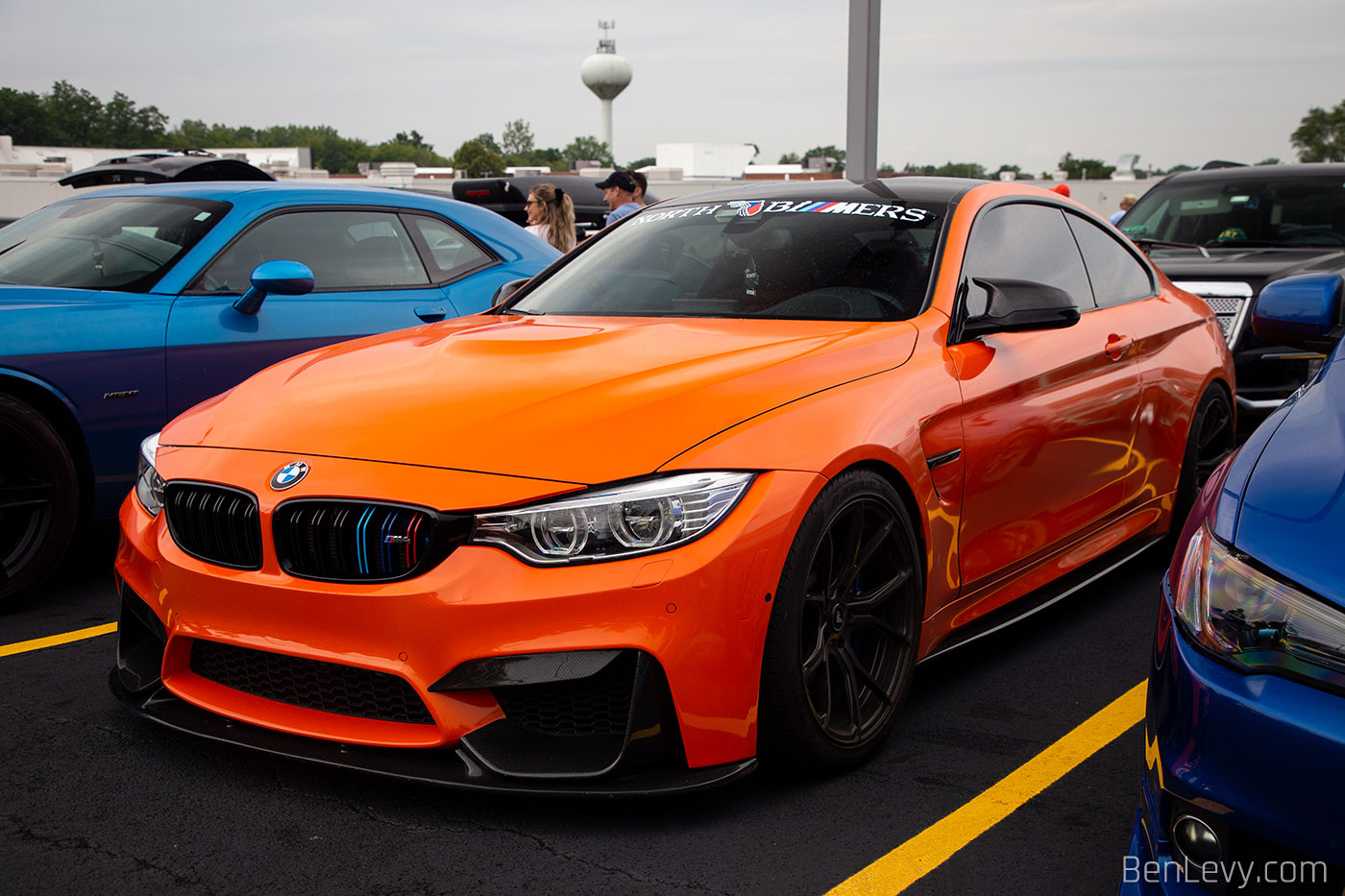 Orange BMW M3 with North Bimmers banner