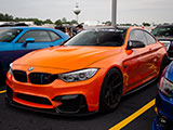 Orange BMW M3 with North Bimmers banner