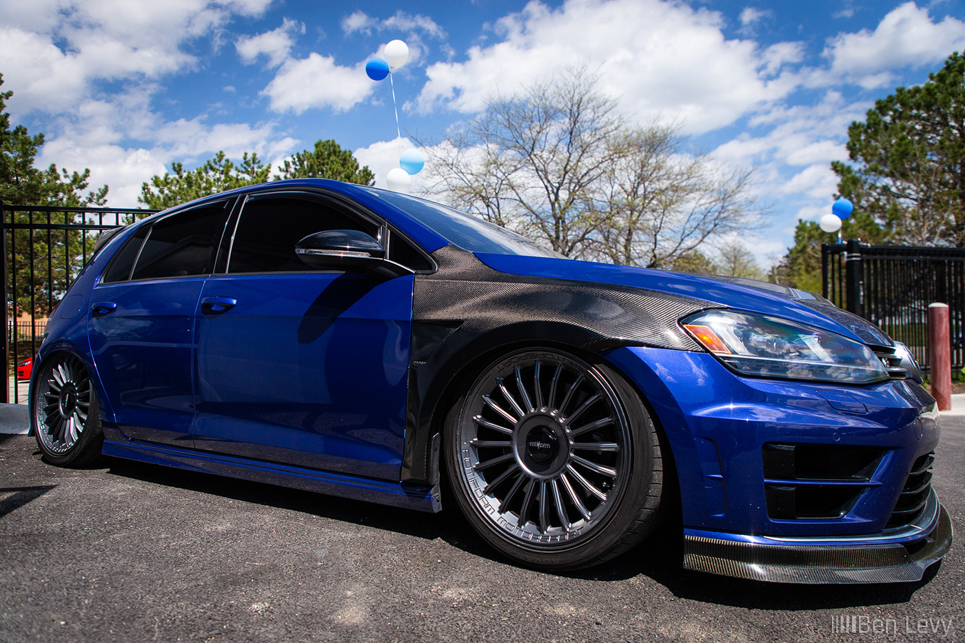 Aired-out Volkswagen Golf R with Carbon Fiber Fenders