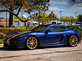 Blue Porsche 718 Cayman GT4 at Big Door Garage Suites