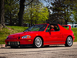 Red, Turbocharged Honda del Sol with the top off