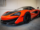 Helios Orange McLaren 600LT at Big Door Garage Suites