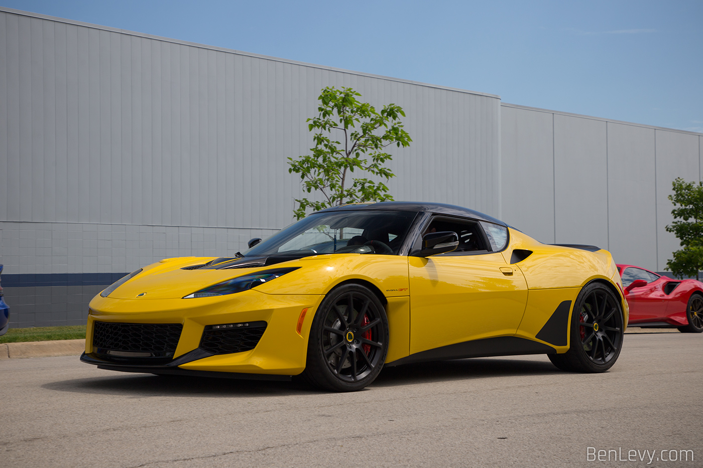 Yellow Lotus Evora GT on the road in Addison