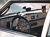 Interior of White Toyota Corolla SR5 Liftback with Puerto Rican Flag