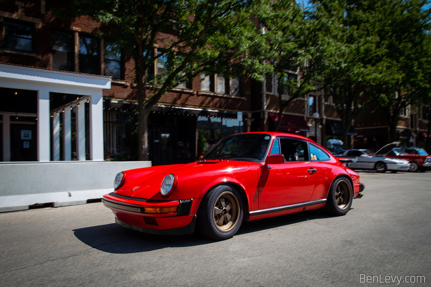 Red Porsche 911 on Bronze Wheels