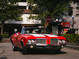 Red Oldsmobile Cutlass Convertible