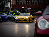 Yellow Porsche Cayman with front lip