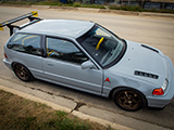 Grey Honda Civic Hatchback with A Few Guys With Zip Ties