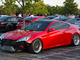 Red Hyundai Genesis coupe with the bumper off
