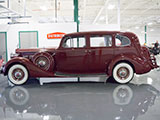 Side of Indian Red Packard Super Eight Limousine