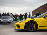 Yellow Porsche 911 GT3 RS in front of Chicago Auto Pros Lombard