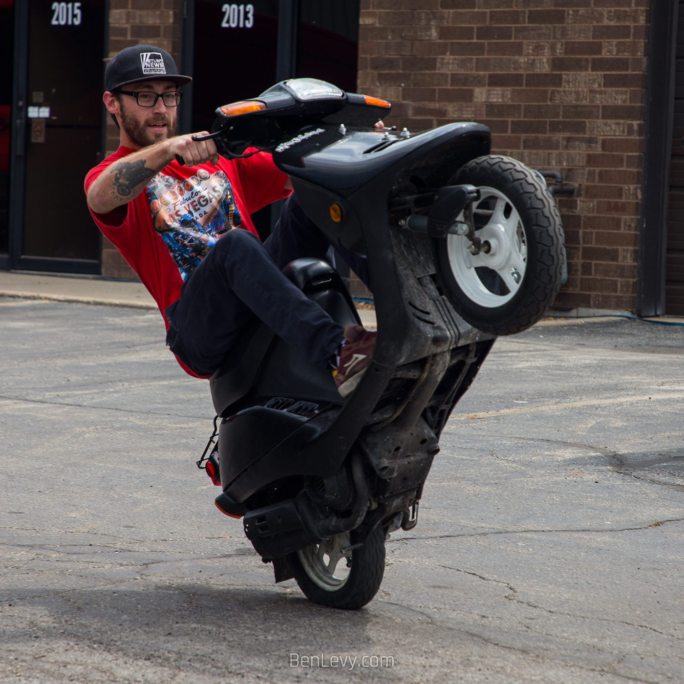 Justin Bianco doing a Wheelie on a Scooter
