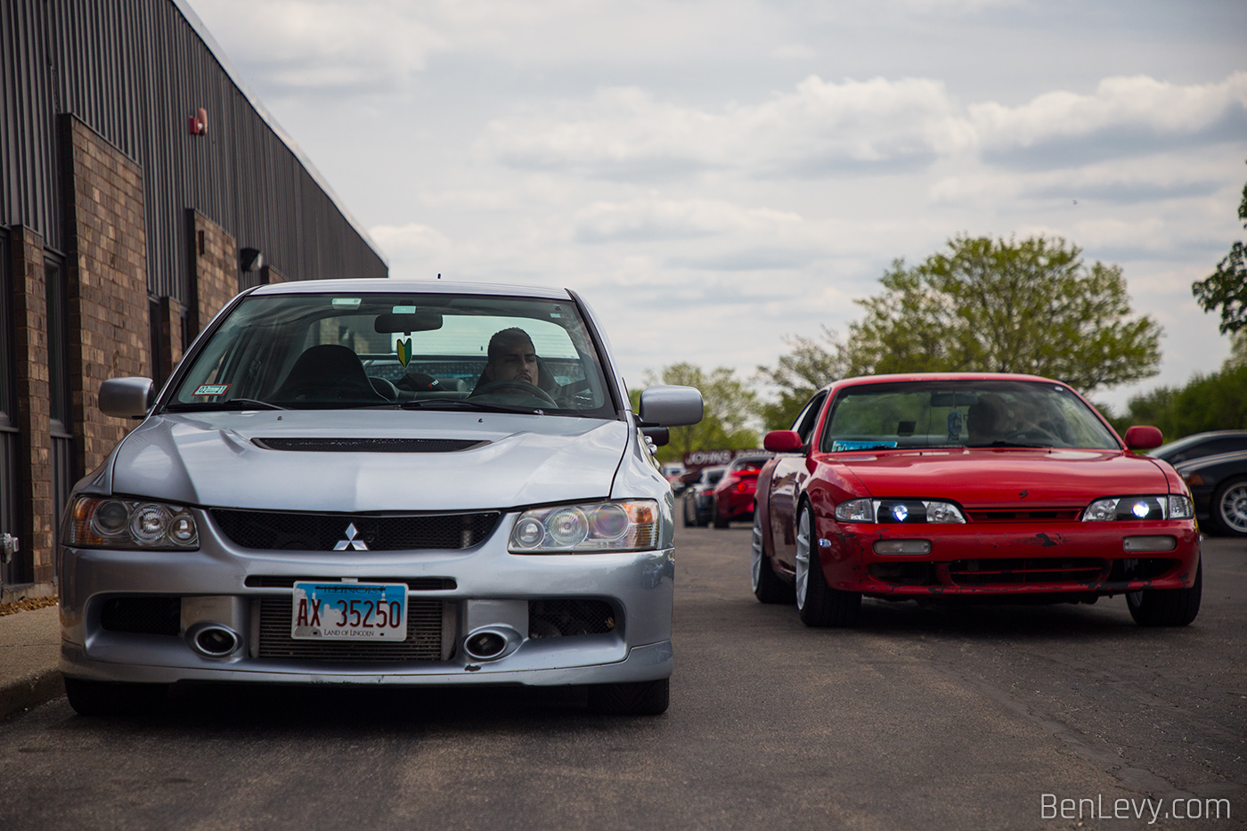 Silver Lancer Evo and Red 240SX