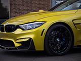 Black OEM Wheels on Yellow BMW M4