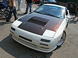 White FC RX-7 outside of Sound Performance Racing