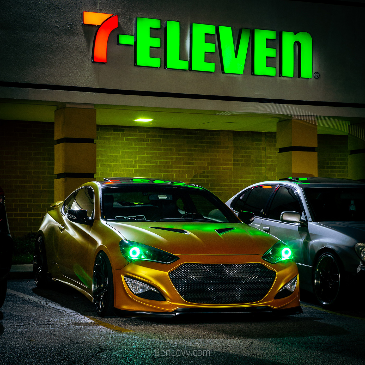 Hyundai Genesis with Green Eyes in front of the 7-Eleven
