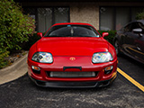 Front of Red Toyota Supra