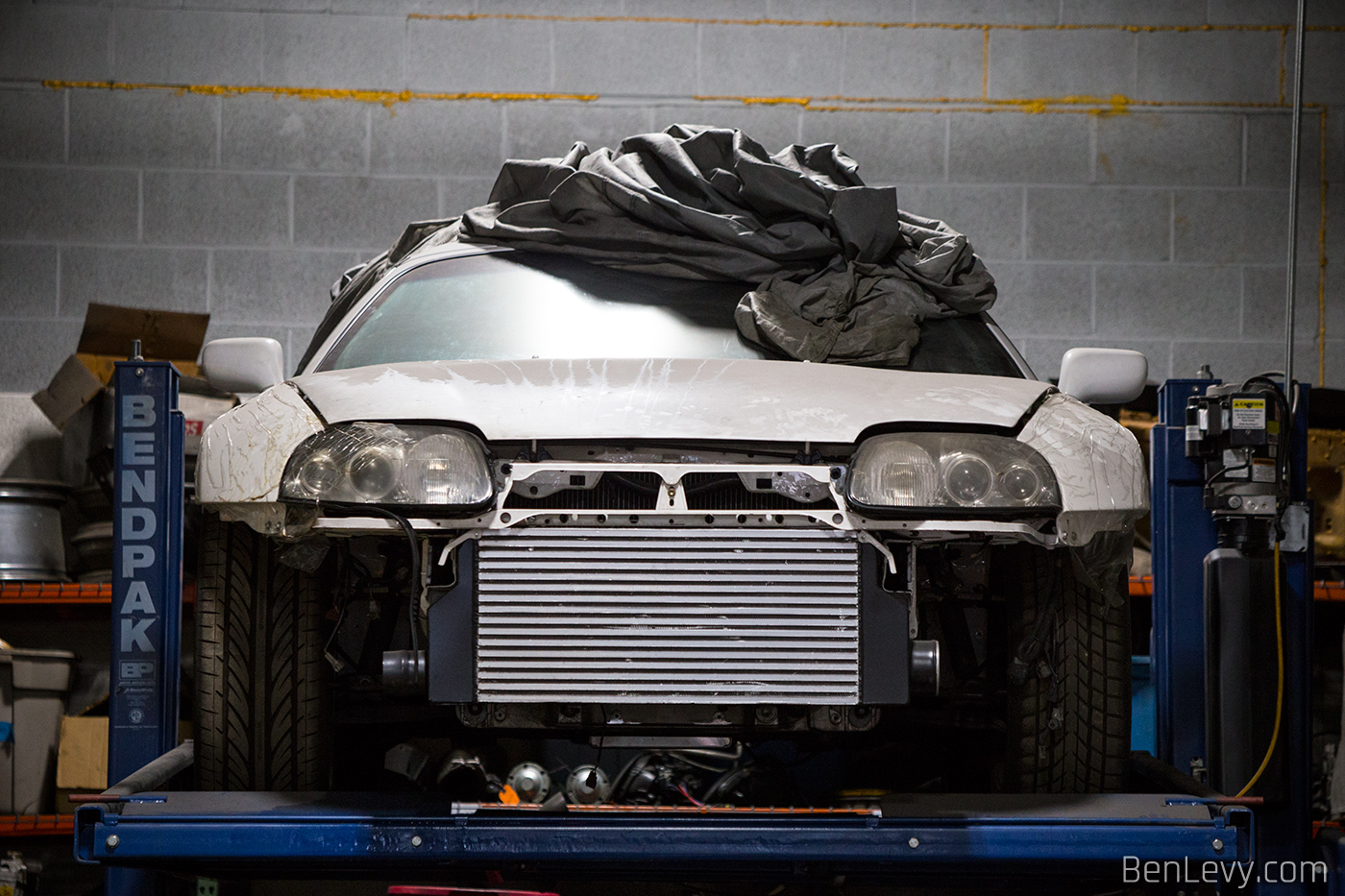 White Toyota Supra with the bumper off