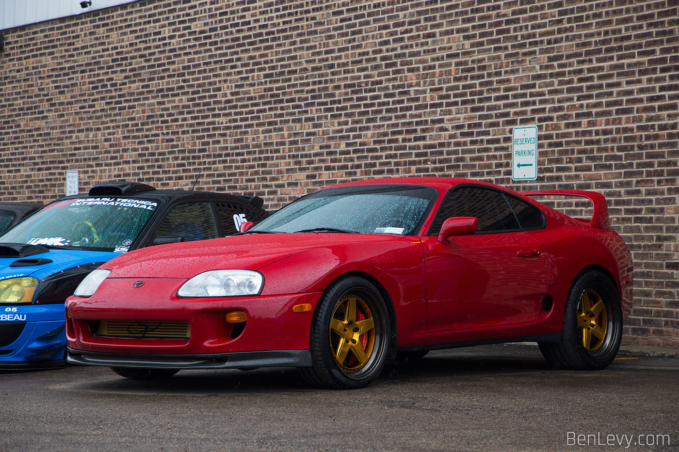 Red Toyota Supra on Gold Wheels