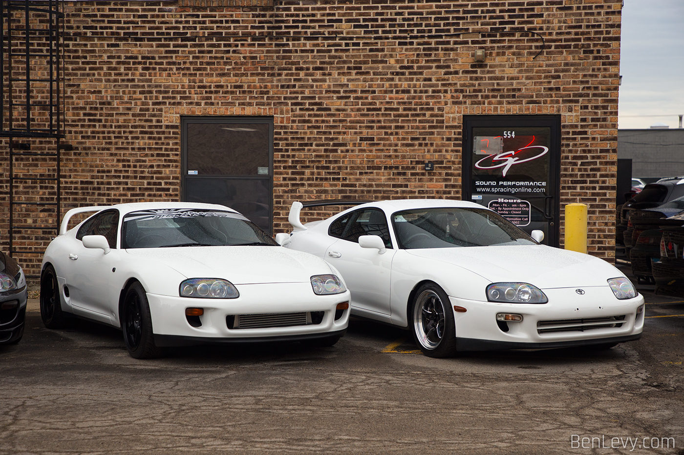 Pair of White Toyota Supras