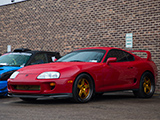 Red Toyota Supra on Gold Wheels