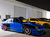 Blue Subaru WRX STI with Black Overfenders