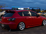 Red Mazdaspeed3 with JNC014 wheels