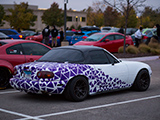 NA Miata with purple graphics