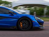 Blue McLaren 600LT rolling down the street