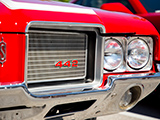 The Grille and Headlights of an Oldsmobile 442