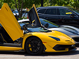 Yellow Lamborghini Aventador SVJ with doors up