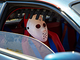 Jason mask in a Ferrari