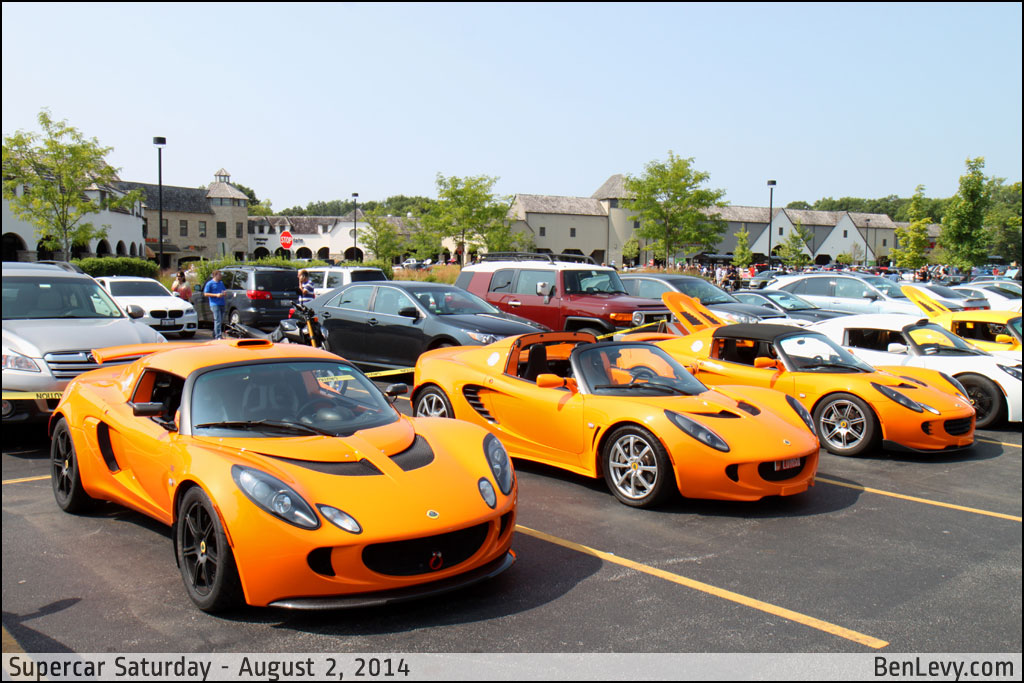 Three Orange Lotuses at Supercar Saturday in Bannockburn, IL