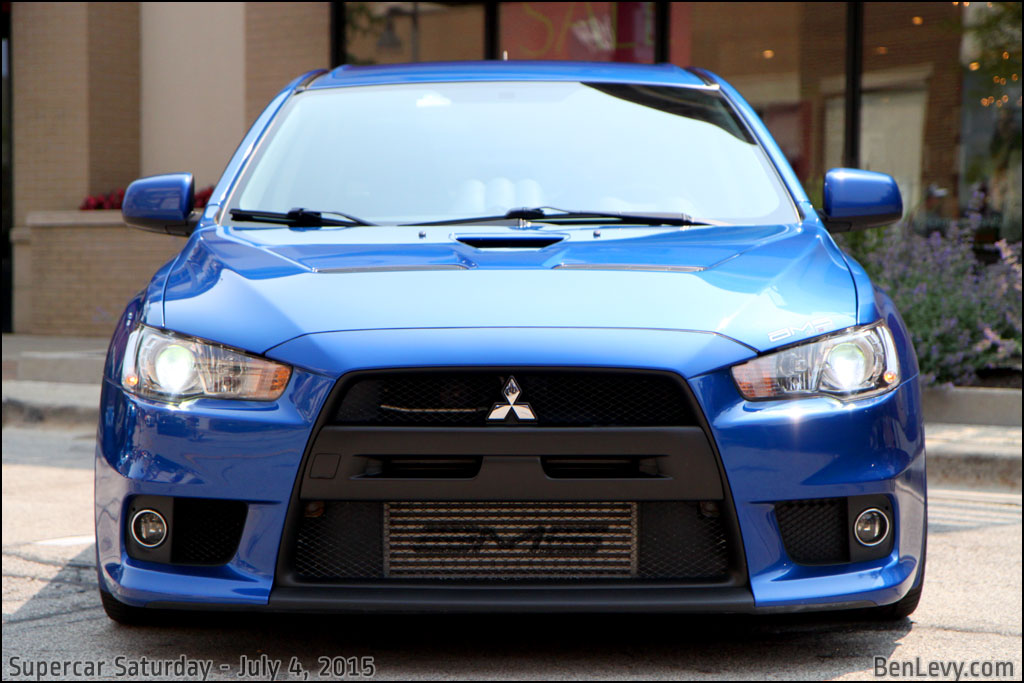 Front of Blue Mitsubishi Lancer Evolution X