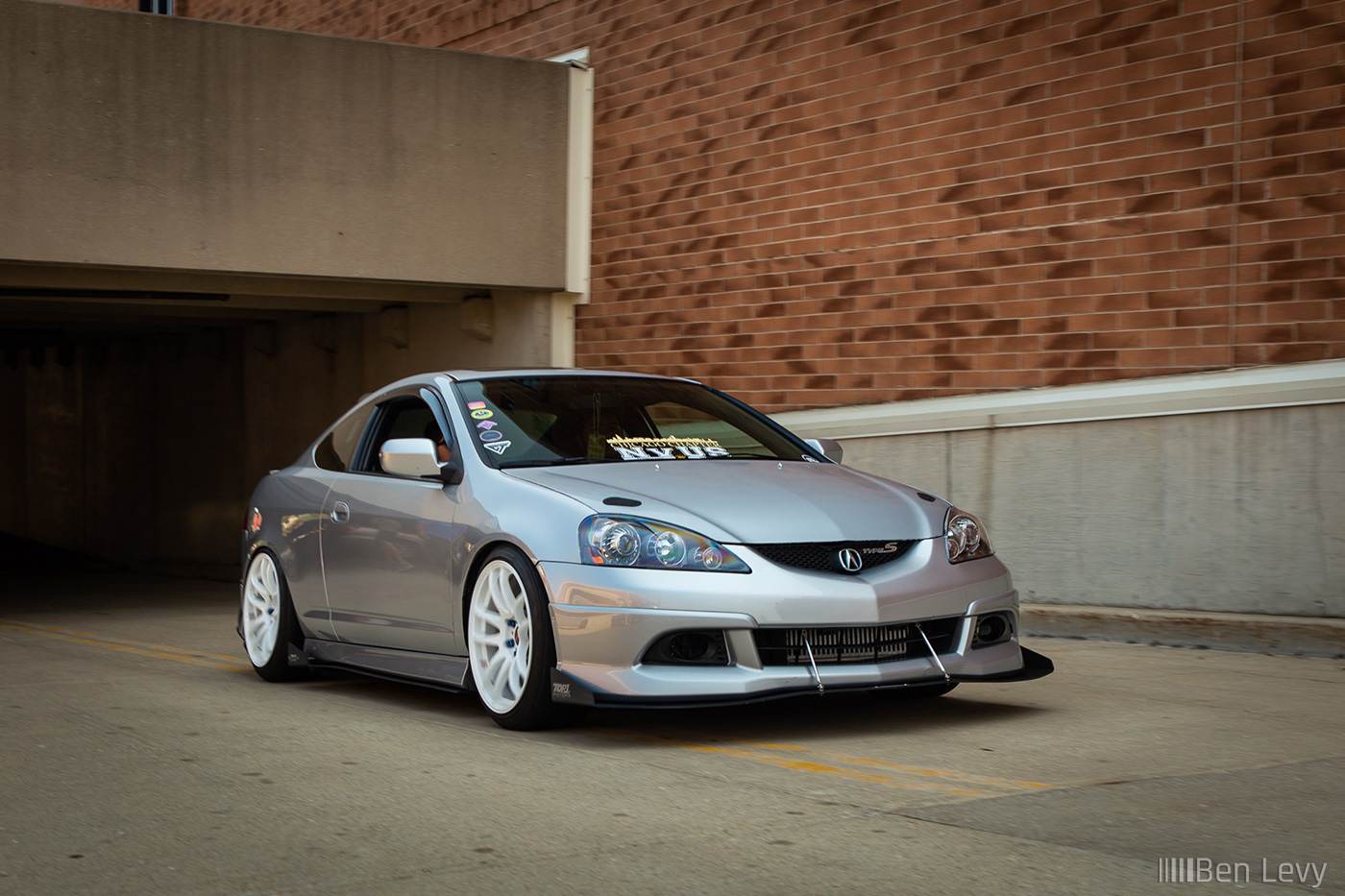 Silver Acura RSX Driving Up a Ramp