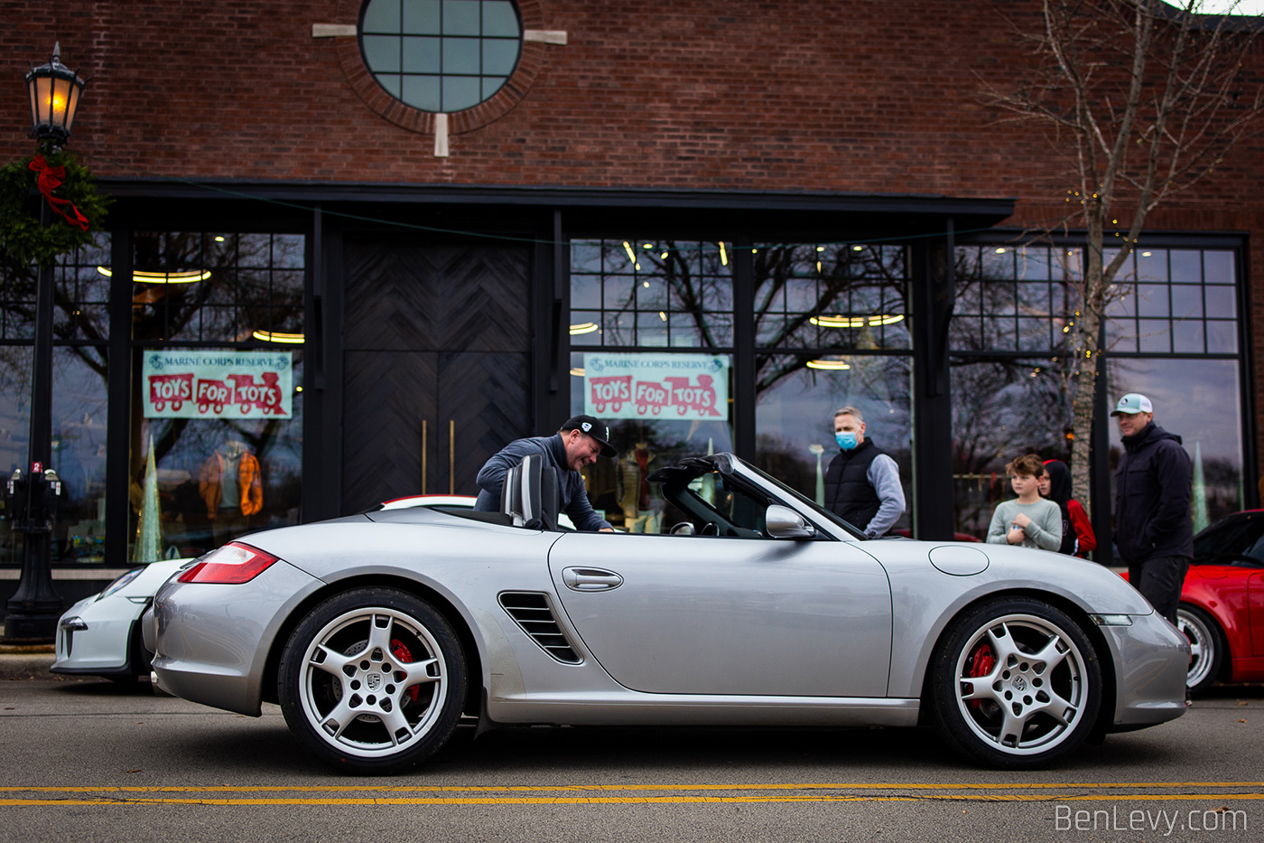 Silver Porsche Boxster at the Burdi Toys For Tots Toy Drive