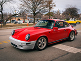 Red Porsche 911 with Unpainted Bumper