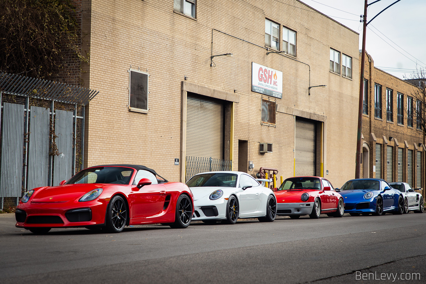 Porsches parked on Fulton for a Toy Drive