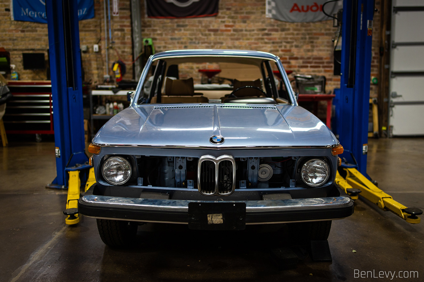 Blue BMW 2002 being restored at Midwest Performance Cars